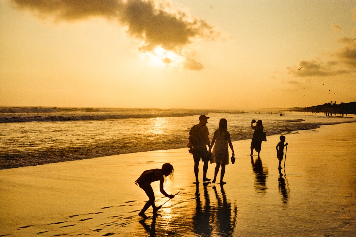 A family walking together on a quiet beach