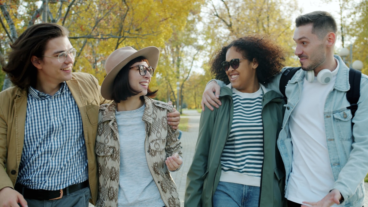 A diverse group of young people walking together outdoors